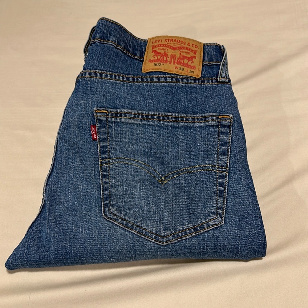 Levi’s 502, W32 L32, light to medium wash denim